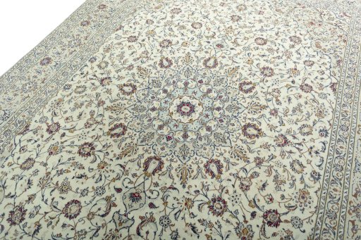 Backside of handmade 2000s Kashan rug showing knot structure and weave density