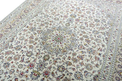 Backside of handmade 2000s Kashan rug showing knot structure and weave density