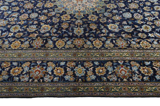 Corner detail of 1970s Kashan rug showing border pattern and Wool pile