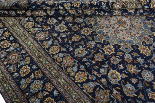Close-up detail of 1970s Kashan rug from Iran / Persia showing Wool weave