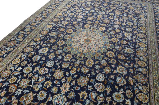 Backside of handmade 1970s Kashan rug showing knot structure and weave density