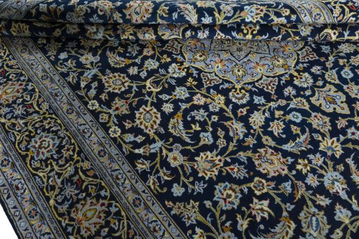 Close-up detail of 2000s Kashan rug from Iran / Persia showing Wool weave