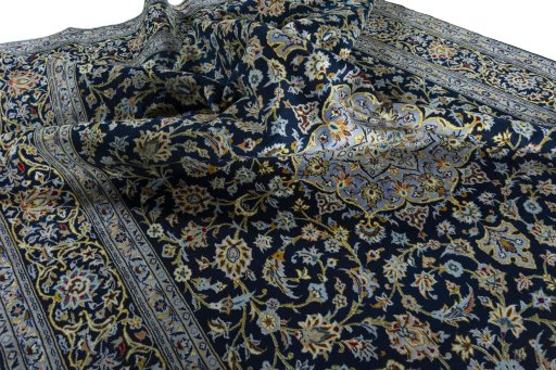 Surface texture of 2000s Kashan rug with natural Wool and intricate pattern