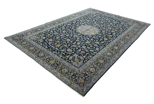 Corner detail of 2000s Kashan rug showing border pattern and Wool pile