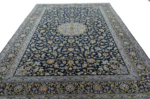 Surface texture of 2000s Kashan rug with natural Wool and intricate pattern