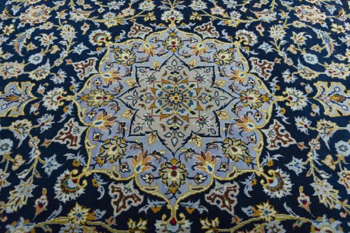Central medallion detail of 2000s Kashan rug from Iran / Persia