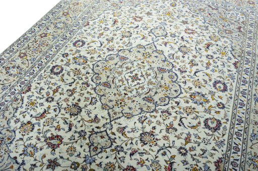 Backside of handmade 2000s Kashan rug showing knot structure and weave density