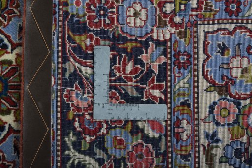 Backside of handmade 2000s Kashan rug showing knot structure and weave density