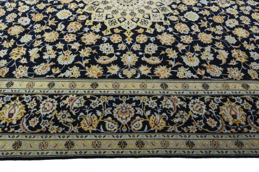 Corner detail of 2000s Kashan rug showing border pattern and Wool pile