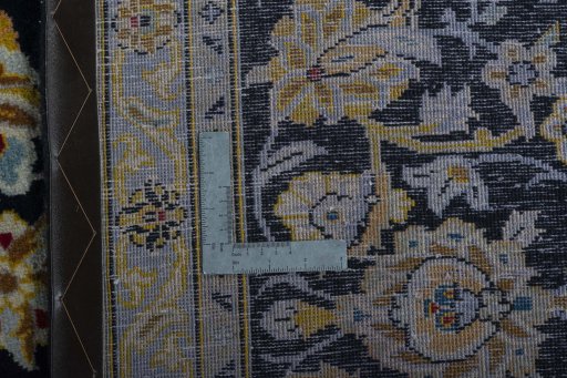Backside of handmade 2000s Kashan rug showing knot structure and weave density