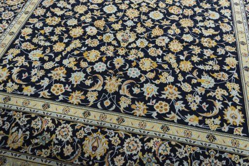 Close-up detail of 2000s Kashan rug from Iran / Persia showing Wool weave