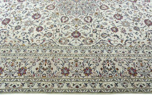 Corner detail of 2000s Kashan rug showing border pattern and Wool pile