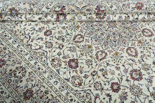 Close-up detail of 2000s Kashan rug from Iran / Persia showing Wool weave