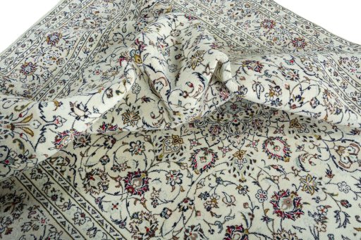 Surface texture of 2000s Kashan rug with natural Wool and intricate pattern