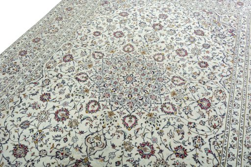 Backside of handmade 2000s Kashan rug showing knot structure and weave density