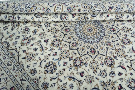 Close-up detail of 2000s Kashan rug from Iran / Persia showing Wool weave