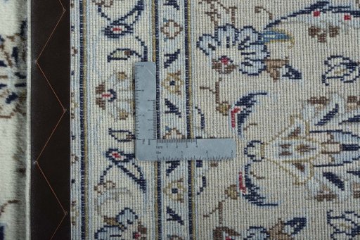 Backside of handmade 2000s Kashan rug showing knot structure and weave density