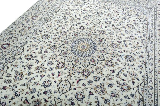 Backside of handmade 2000s Kashan rug showing knot structure and weave density