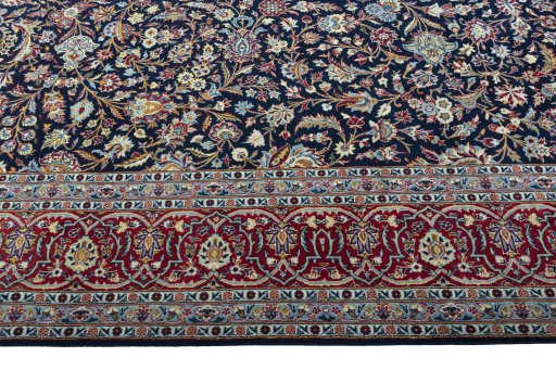 Close-up detail of 2000s Kashan rug from Iran / Persia showing Wool weave