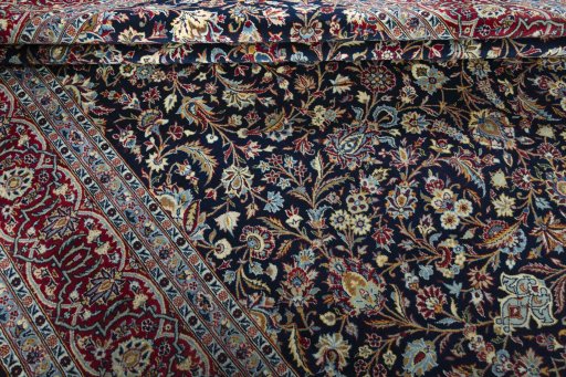 Surface texture of 2000s Kashan rug with natural Wool and intricate pattern