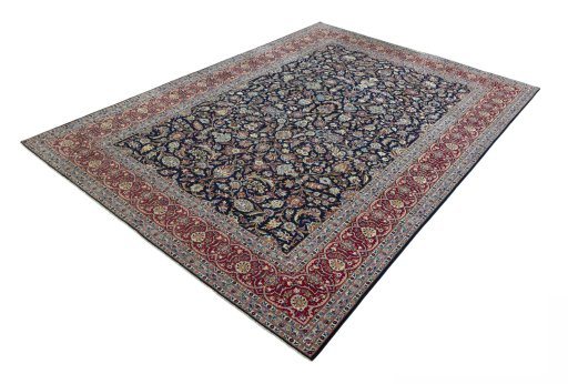 Corner detail of 2000s Kashan rug showing border pattern and Wool pile