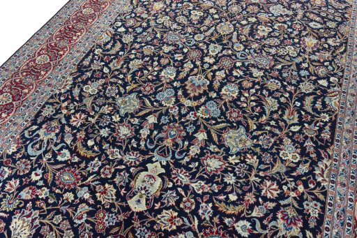 Backside of handmade 2000s Kashan rug showing knot structure and weave density