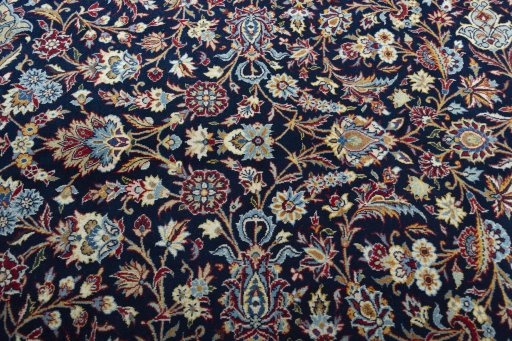 Close-up detail of 2000s Kashan rug from Iran / Persia showing Wool weave