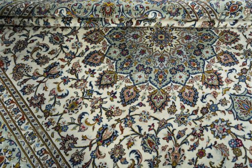 Close-up detail of 2000s Kashan rug from Iran / Persia showing Wool weave