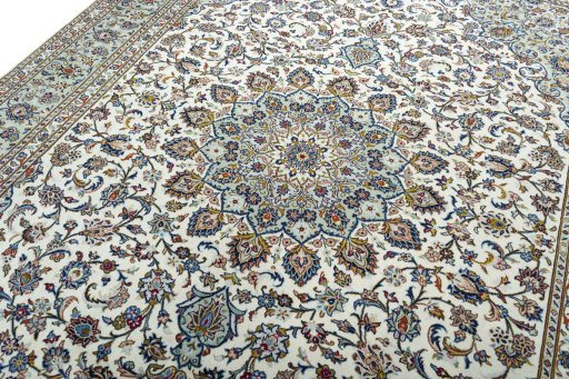 Backside of handmade 2000s Kashan rug showing knot structure and weave density