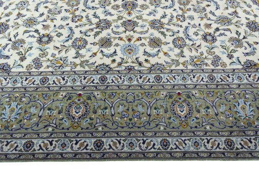 Corner detail of 2000s Kashan rug showing border pattern and Wool pile