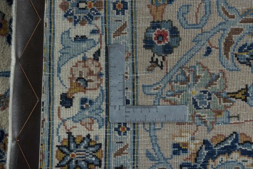 Backside of handmade 2000s Kashan rug showing knot structure and weave density