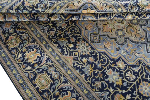 Close-up detail of 2000s Kashan rug from Iran / Persia showing Wool weave