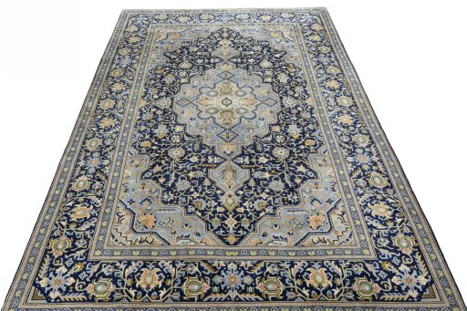 Surface texture of 2000s Kashan rug with natural Wool and intricate pattern