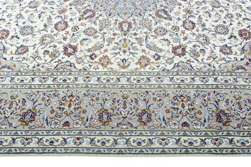 Corner detail of 2000s Kashan rug showing border pattern and Wool pile
