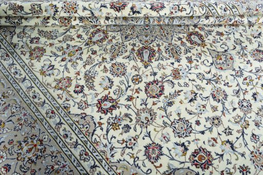 Close-up detail of 2000s Kashan rug from Iran / Persia showing Wool weave
