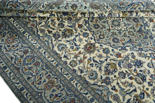 Close-up detail of 2000s Kashan rug from Iran / Persia showing Wool weave