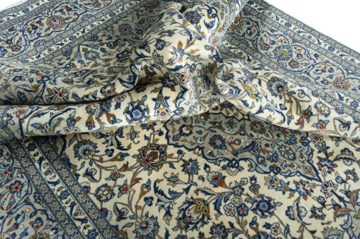 Surface texture of 2000s Kashan rug with natural Wool and intricate pattern