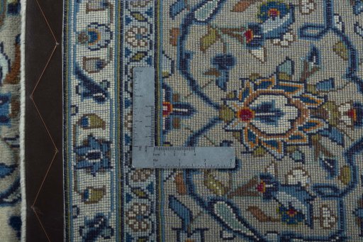 Backside of handmade 2000s Kashan rug showing knot structure and weave density