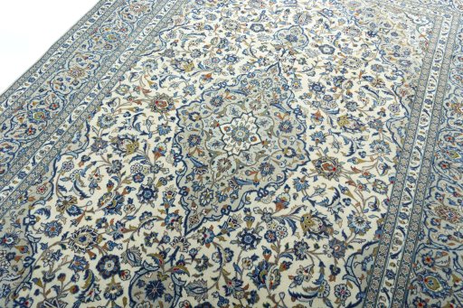 Backside of handmade 2000s Kashan rug showing knot structure and weave density