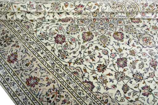 Close-up detail of 2000s Kashan rug from Iran / Persia showing Wool weave
