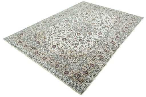 Corner detail of 2000s Kashan rug showing border pattern and Wool pile
