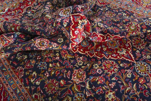 Surface texture of 2000s Kashan rug with natural Wool and intricate pattern