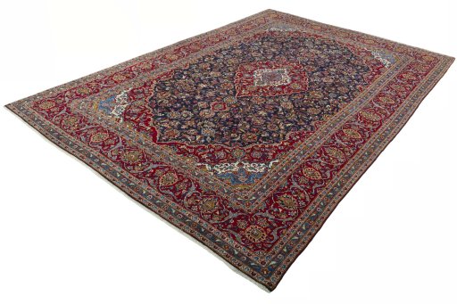 Corner detail of 2000s Kashan rug showing border pattern and Wool pile