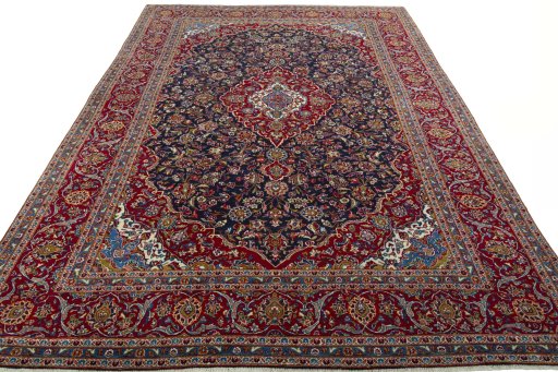 Surface texture of 2000s Kashan rug with natural Wool and intricate pattern
