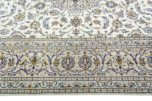 Corner detail of 2000s Kashan rug showing border pattern and Wool pile
