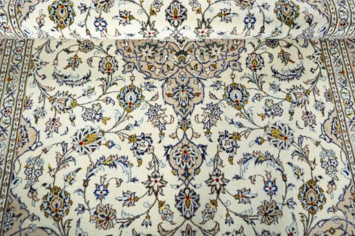 Close-up detail of 2000s Kashan rug from Iran / Persia showing Wool weave
