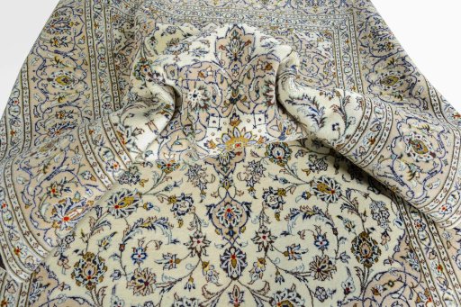 Surface texture of 2000s Kashan rug with natural Wool and intricate pattern