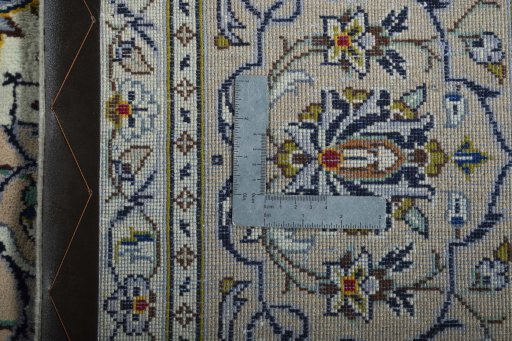 Backside of handmade 2000s Kashan rug showing knot structure and weave density
