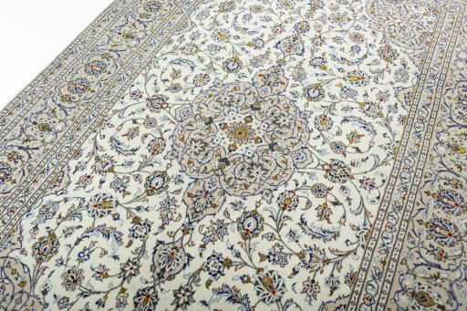 Backside of handmade 2000s Kashan rug showing knot structure and weave density