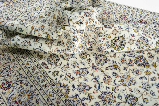 Surface texture of 2000s Kashan rug with natural Wool and intricate pattern